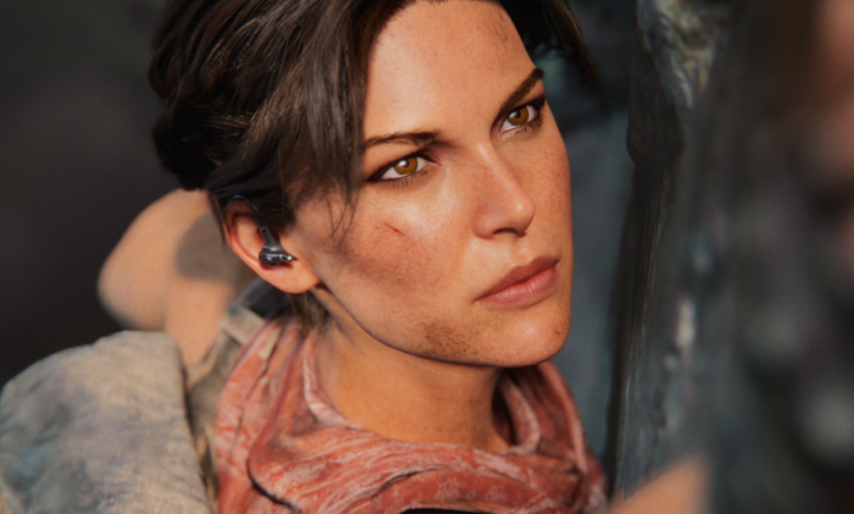 Close-up of Lara Croft with dirt and a scar on her face, looking determined.