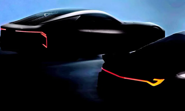 Silhouetted sports cars with red taillights against a blue background.