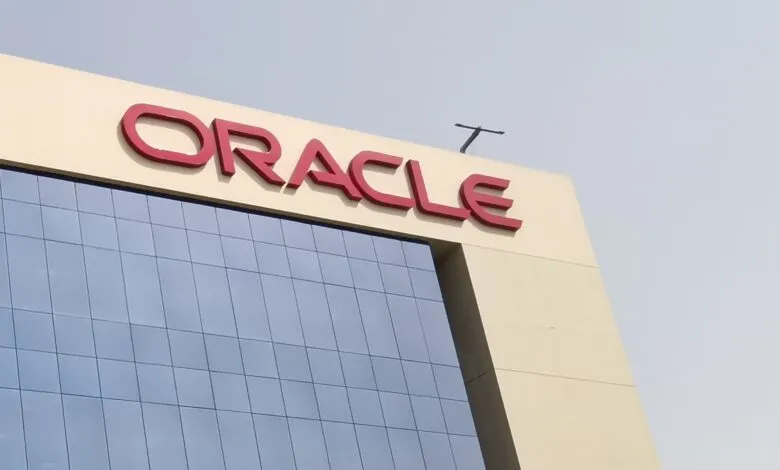 Oracle building with red logo against a blue sky backdrop.