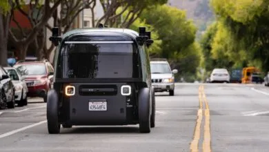 Rear view of a Zoox autonomous vehicle on a city street.