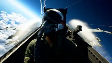 Pilot's view from a fighter jet cockpit during aerial combat.