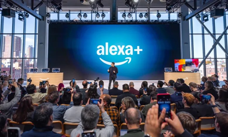 Audience watches speaker at Alexa+ event with large screen and city view.