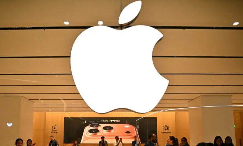 Apple store interior with large logo and iPhone 17 Pro display.