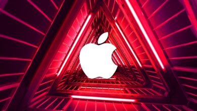 Apple logo in a red triangular tunnel, perspective view.