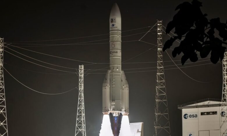 Ariane 6 rocket launching at night, flames visible.