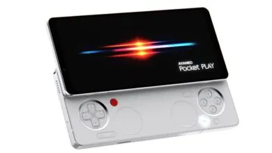 Silver Ayaneo Pocket Play handheld gaming device with screen on.