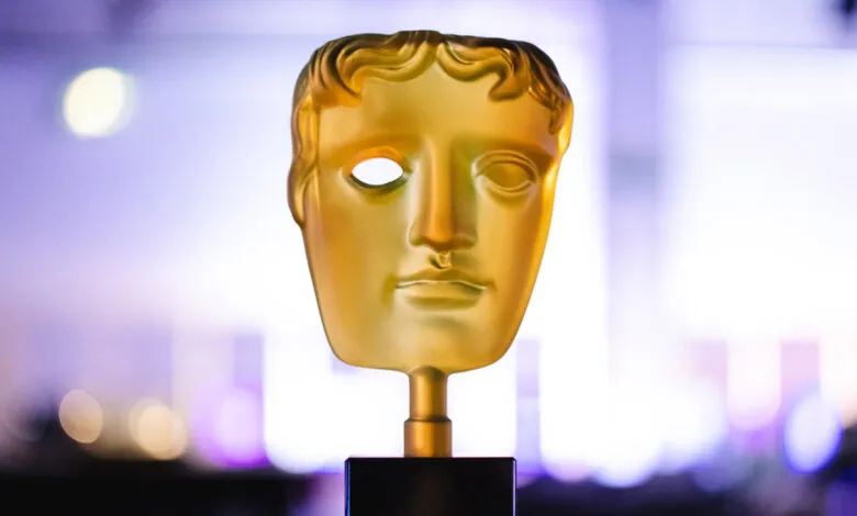 Close-up of a golden BAFTA award statue with a missing eye.
