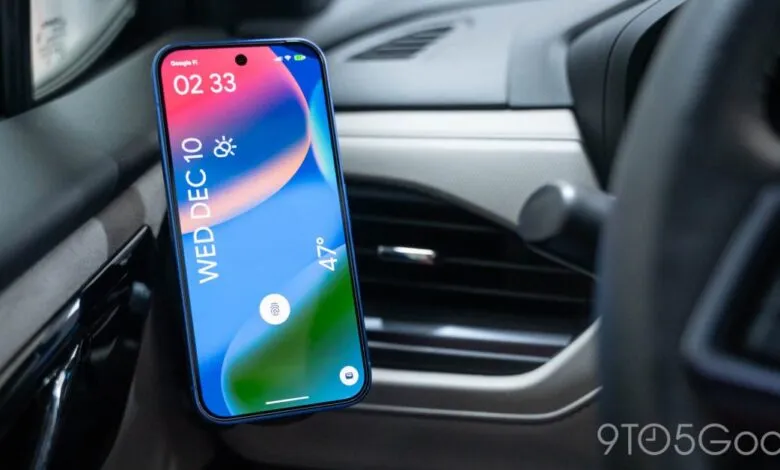Smartphone mounted in car showing weather and time.