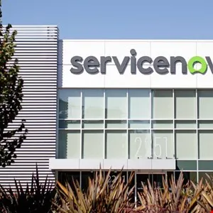 ServiceNow building exterior with logo and address number visible.
