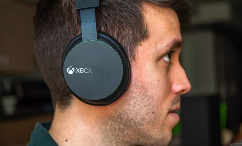 Man wearing black Xbox wireless headset, looking to the side.