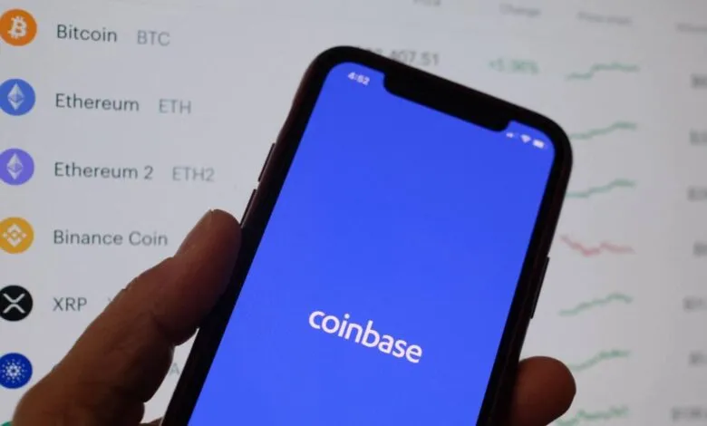 Coinbase app displayed on a smartphone screen with crypto data.