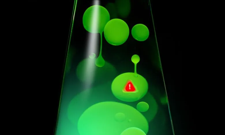 Green lava lamp with a red warning sign inside one of the blobs.