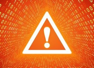 Warning sign with exclamation point against a binary code background.