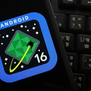 Android 16 game icon displayed on a phone screen next to a keyboard.