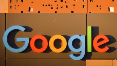 Google logo sign with colorful letters on a building facade.