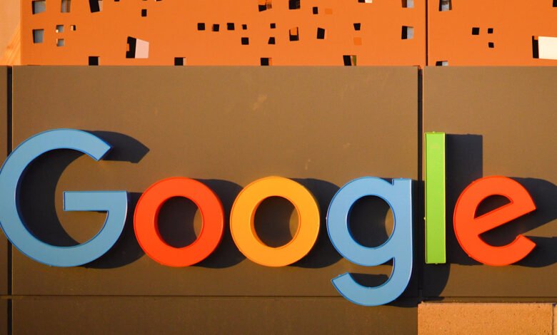 Google logo sign with colorful letters on a building facade.