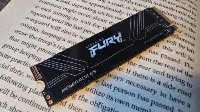 Kingston Fury Renegade G5 NVMe SSD on a book page.