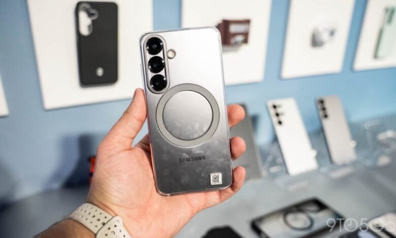 Hand holding Samsung phone with clear case and MagSafe-like ring.