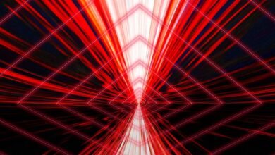 Abstract red and white geometric tunnel with diamond shapes.