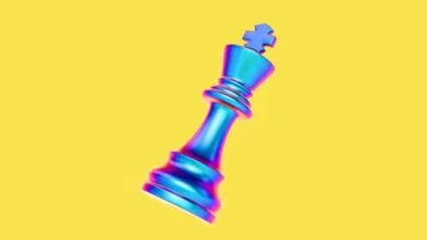 Iridescent chess king piece on a yellow background.