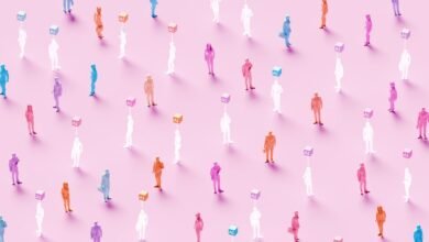 Colorful figures connected to AI cubes on pink background.