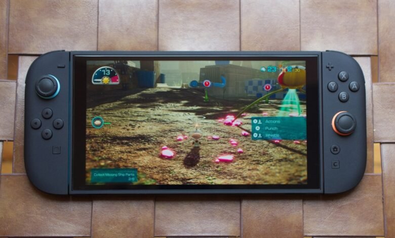 Nintendo Switch OLED playing Pikmin 4, showing in-game action.