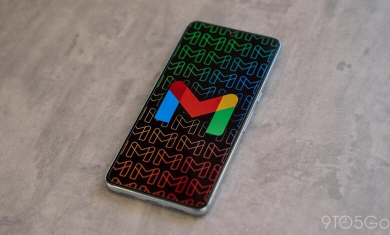 Smartphone displaying the Gmail app icon on a patterned background.