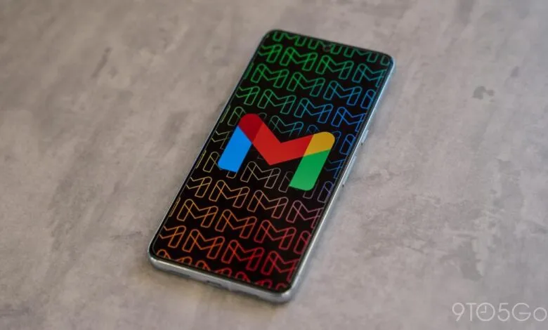 Smartphone displaying the Gmail app icon on a patterned background.