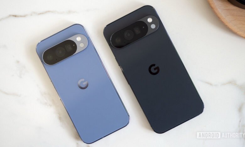 Two Google Pixel phones, one blue and one black, on a marble surface.
