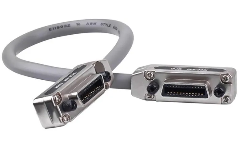IEEE-488 GPIB cable with two connectors, gray cable, close-up view.