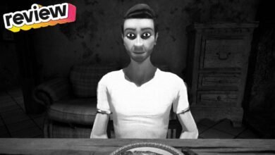 Black and white image of a man sitting at a table with 'review' text overlay.