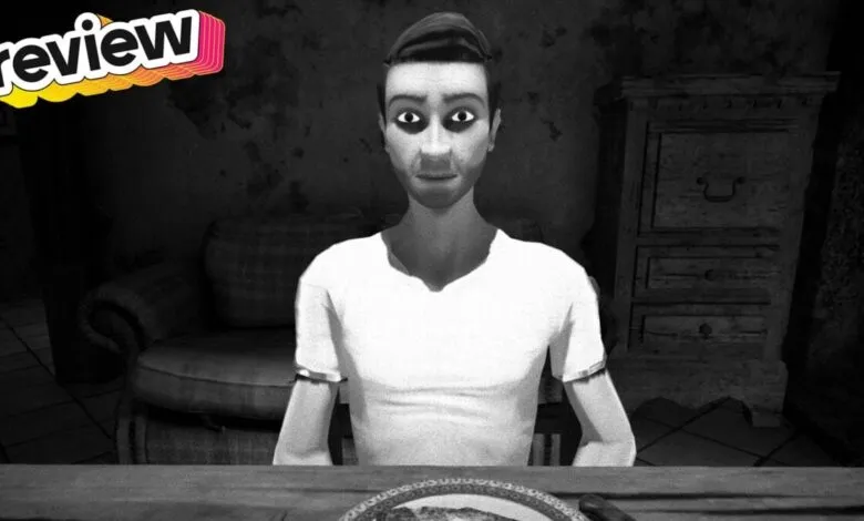 Black and white image of a man sitting at a table with 'review' text overlay.