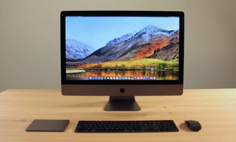 iMac Pro on a desk with keyboard, trackpad, and mouse.