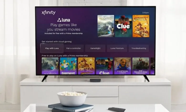Xfinity TV displaying Luna game streaming service on a white cabinet.