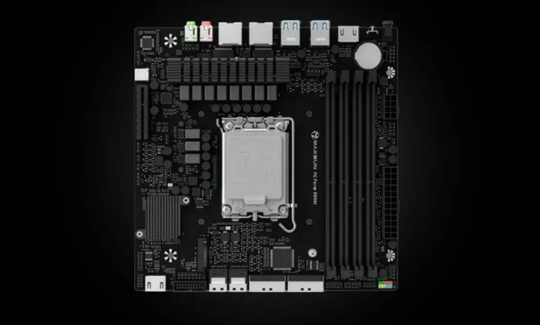 Close-up of a MAXSUN PC FATA MB 00101 motherboard against a black background.