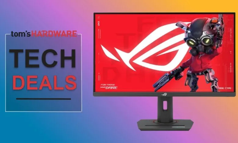 ROG gaming monitor displaying a robot character on a red background.