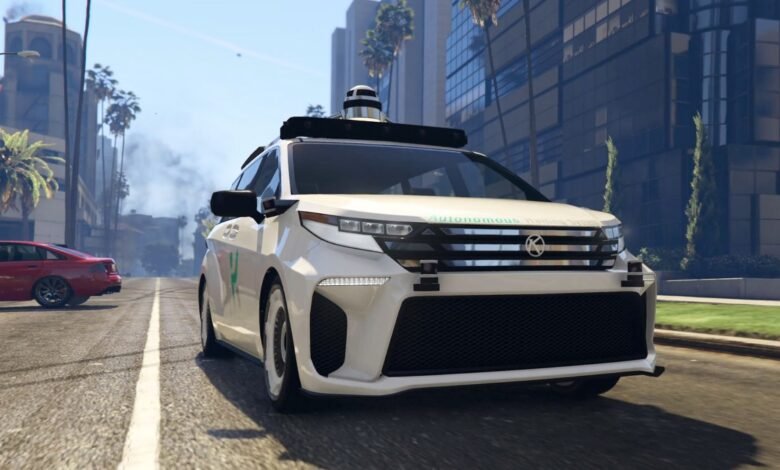 White autonomous vehicle on city street with palm trees and buildings.