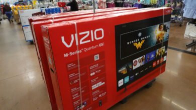 Stacked VIZIO M-Series Quantum 65" TVs in retail setting.