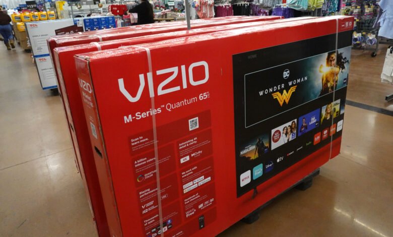 Stacked VIZIO M-Series Quantum 65" TVs in retail setting.