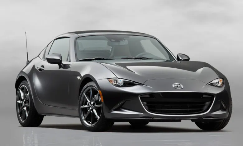 Gray Mazda Miata RF coupe with sleek design and sporty wheels.