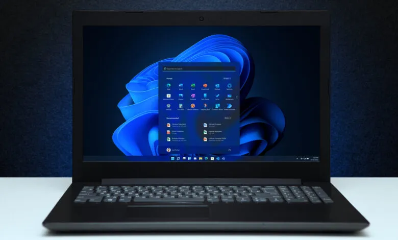 Laptop displaying the Windows 11 operating system with the start menu open.