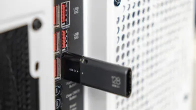 Black USB 3.1 drive plugged into a computer USB 10G port.