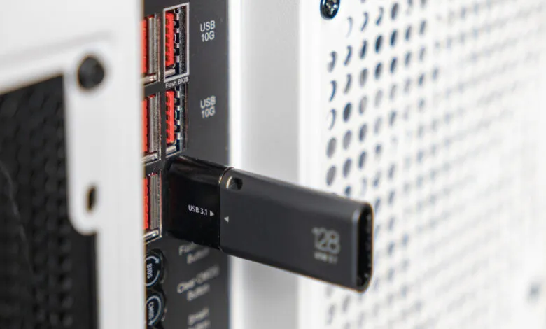 Black USB 3.1 drive plugged into a computer USB 10G port.