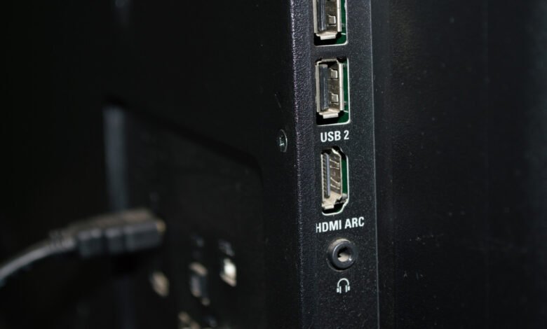 Close-up of the back of a TV with USB and HDMI ports.