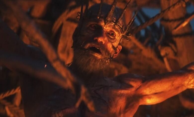 Man with crown and beard tied with ropes, distressed expression.