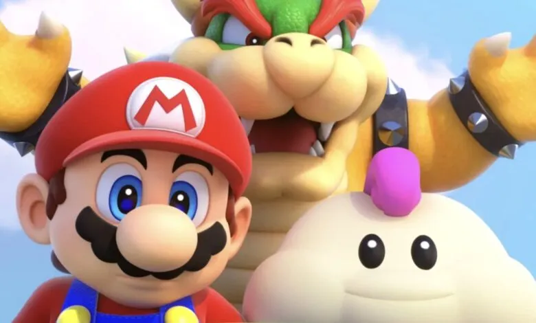 Mario, Bowser, and a Luma character pose together against a blue sky.