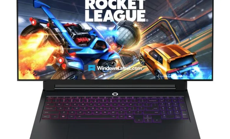Gaming laptop displaying Rocket League gameplay with vibrant RGB keyboard.