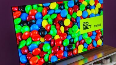 OLED TV displaying colorful candy with a 'ZDNET tested' sticker.
