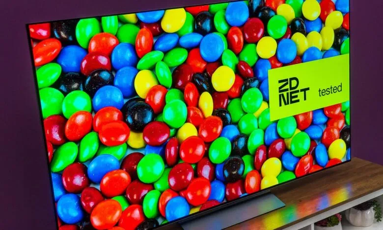 OLED TV displaying colorful candy with a 'ZDNET tested' sticker.