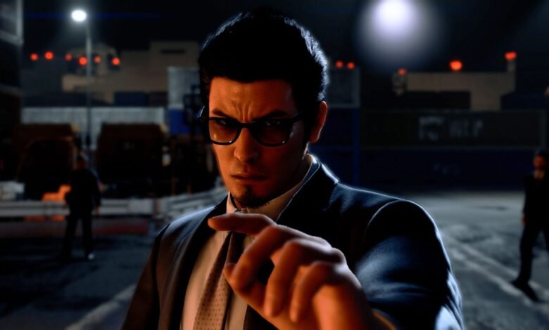 Kazuma Kiryu points directly at the viewer with a stern expression.
